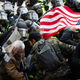 Supporters of US President Donald Trump fight with riot police outside the Capitol building on January 6, 2021 in Washington, DC.